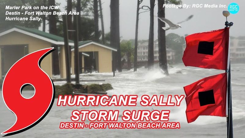 Hurricane warning flags over storm surge in Destin